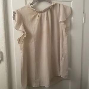 Fin beige blus