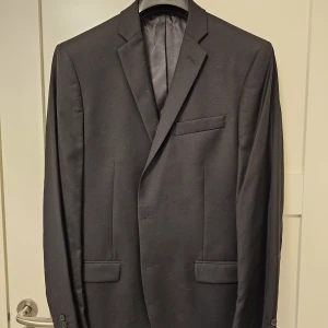 Svart kavaj - Oanvänd kavaj från Calvin Klein