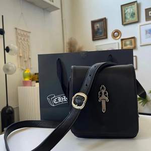 CH ending bag production so purchase while available!  Comes with original packaging & receipt  Black Calf leather  Two interior slots, one zipper pouch  Sick .925 Silver Dagger pendant  Adjustable strap  Purchased 2021 at the wynn in las vegas