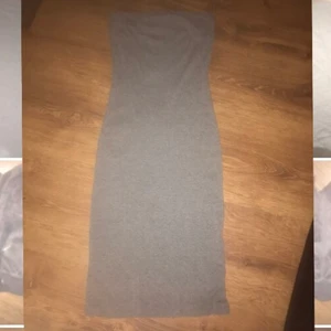 Grå klänning  - Säljer min grå klänning då den inte kommer till användning. Man kan ha den som en högmidjad kjol också. 150 med frakt inräknat 