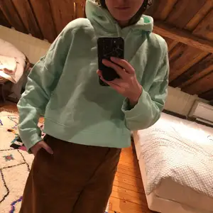Mint green cropped hoodie from Monki. In good shape but has a little spot in the front.