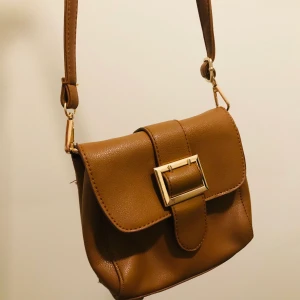 Cute Brown bag  - Selling a Cute small bag which I bought from my home country. It is in a very good condition and is barely used.