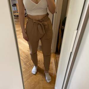 High waisted light brown dress pants. These haven’t been worn often and are in great condition. Shipping not included. 