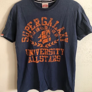 Superdry Classic Vintage College Tee - Superdry Classic Vintage College Style T-Shirt  Size small, men’s fit.  Great condition, no flaws or damage.  DM if you need exact size measurements.   Buyer pays for all shipping costs. All items sent with tracking number.   No swaps, no trades, no offers. 