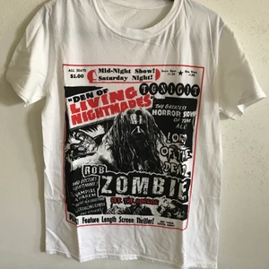 Rob Zombie Horror Movie Poster Tee - Rob Zombie Horror Movie Poster T-Shirt  Size medium, fits like a regular men’s small / medium. Great condition, no flaws or damage.  DM if you need exact size measurements.   Buyer pays for all shipping costs. All items sent with tracking number.   No swaps, no trades, no offers.  