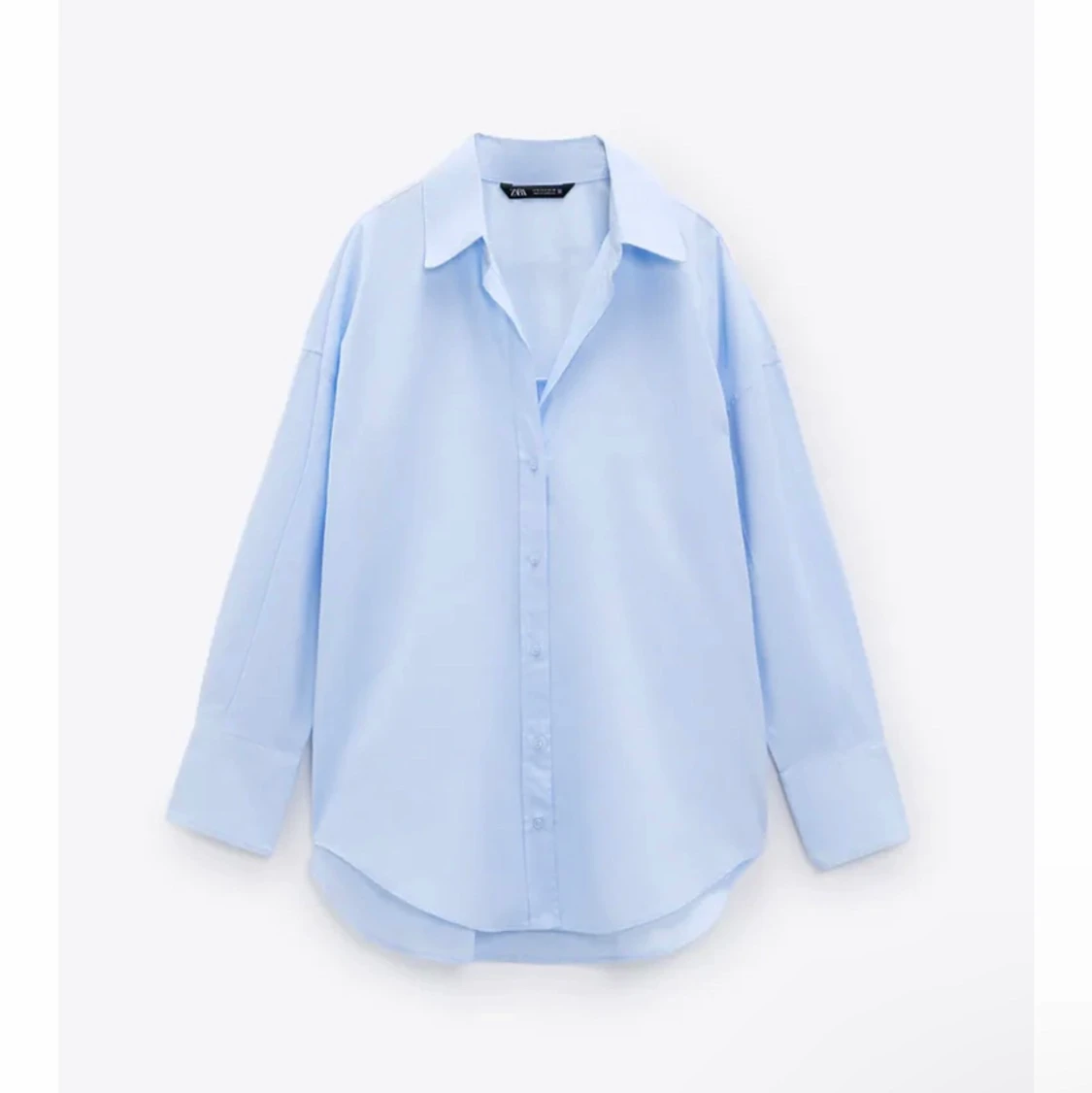 Ljus blå skjorta