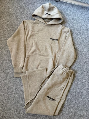 Essentials dark oatmeal gray baggy tracksuit - Size M, true to size. Very comfortable and fits perfectly.