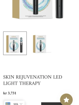 Skin Rejuvenation LED ljusbehandling - Modern LED-ljusterapi för hudföryngring. Verktyget är svart med silverdetaljer och har en rundad topp med blå och röd LED-ljus. Perfekt för dig som vill boosta hudens lyster och minska fina linjer. Kommer i en snygg förpackning.