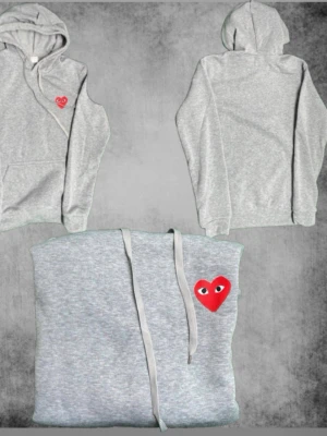 Hoodie Comme des Garçons Play - Snygg grå hoodie från Comme des Garçons Play den är helt ny men inte jätte liknande som den dyra!