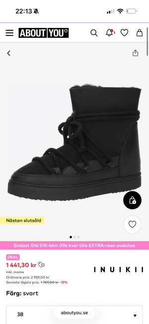 Svarta moon boots från Inuikii - Säljer ett par svarta moon boots från Inuikii med högt skaft och grova snören som går runt hela skon. Bootsens utsida är i matt läder och insidan ser fluffig ut, perfekt för kalla dagar. Snygg chunky sula och minimalistisk design.