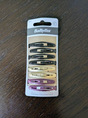 BaByliss hårspännen mixade färger - Säljer ett 8-pack hårspännen från BaByliss . Klämmorna är oanvända.
