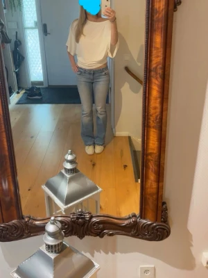 Vit poncho topp - Vit poncho topp från Nelly som knappt är använd.