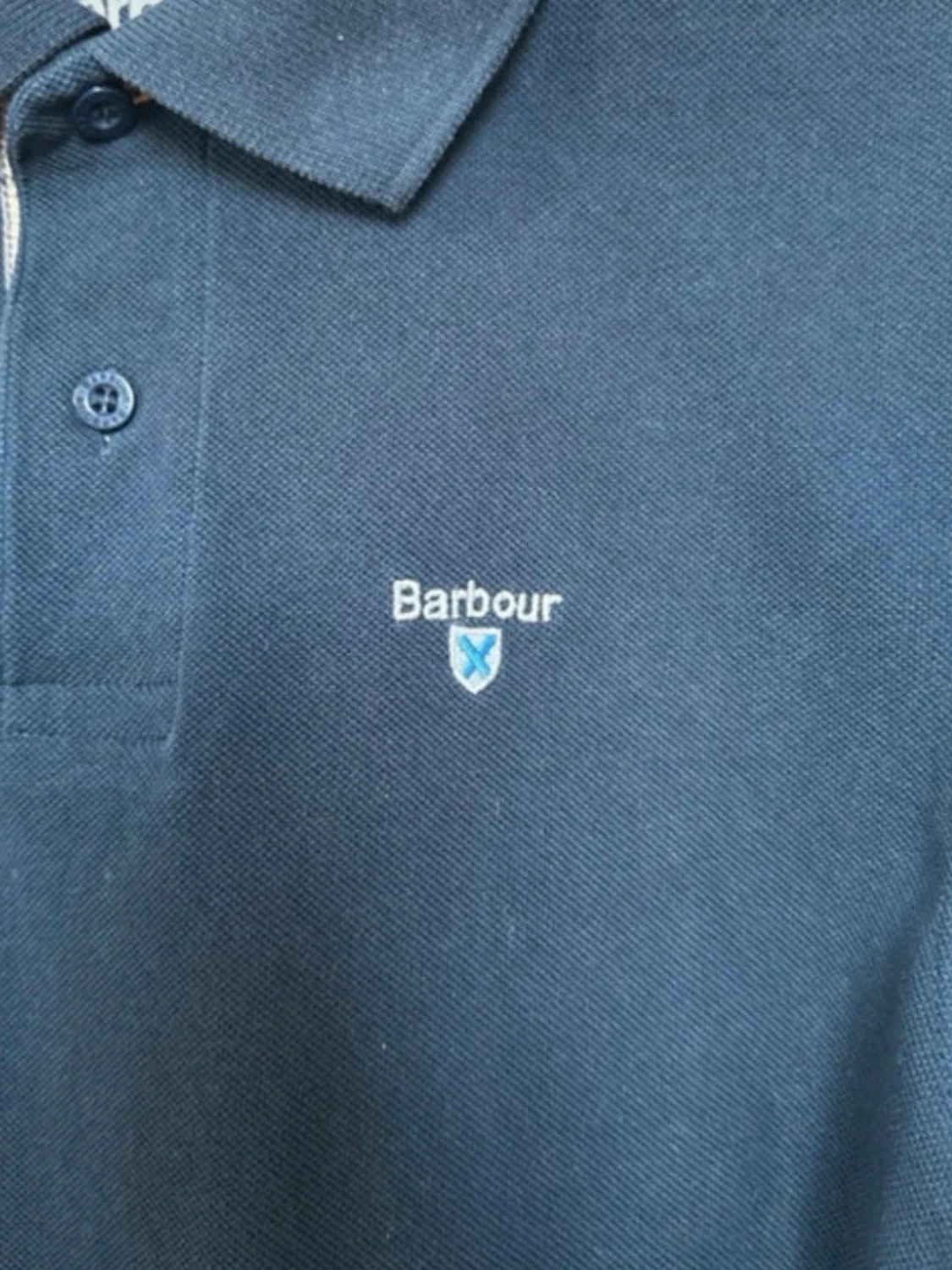 Svart pikétröja från Barbour - 2