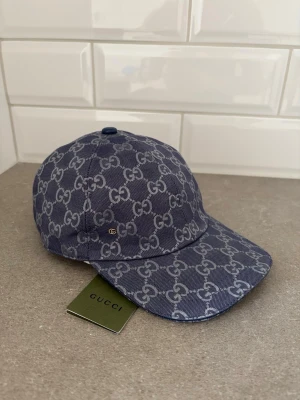 GG keps - Helt ny gg keps i mörk blå färg, strl S/M( går att justera den)