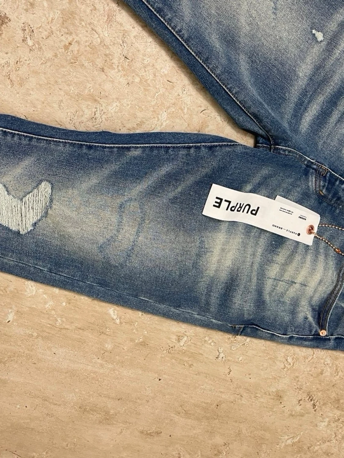 Blå slitna jeans från Purple - 1