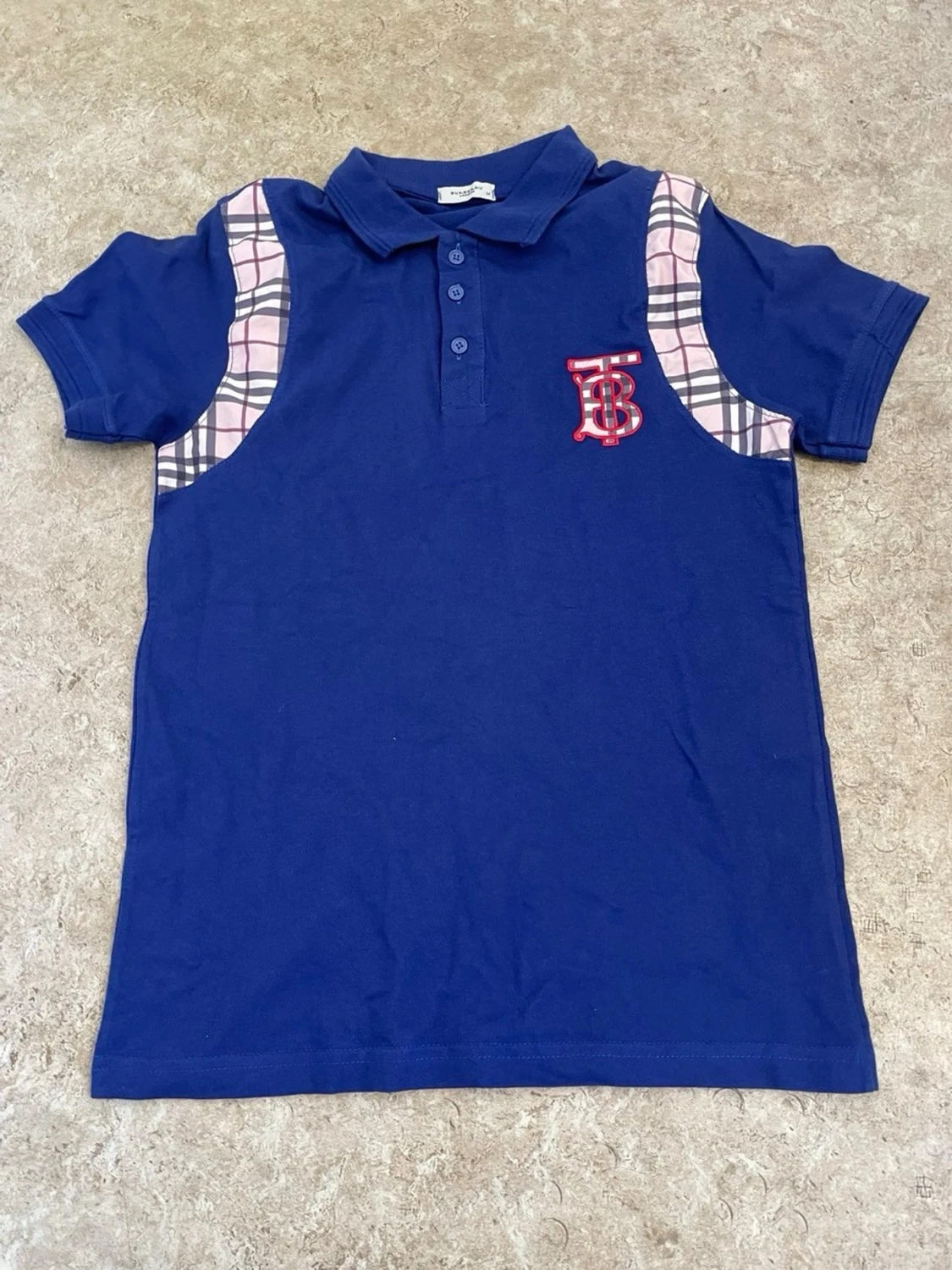 Blå pikétopp med rutiga detaljer