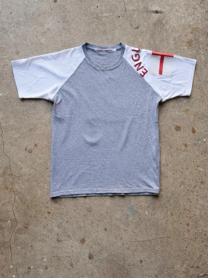 Upcycled raglan t-shirt  - Upcycled raglan tee we’ve sewn, combining two vintage graphic tees. Boxy fit and in great condition, 100% cotton