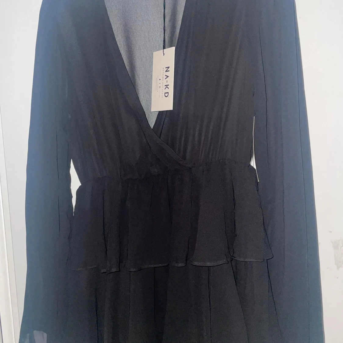 Svart omlottklänning från Na-Kd