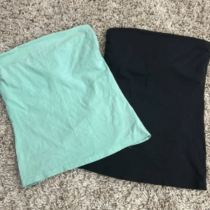 Två tubtoppar från H&M svarta finns bara kvar! (Styck pris) - Säljer två tubtoppar från H&M i färgerna svart och mintgrön. Perfekta för en stilren och enkel look. Tillverkade i ett mjukt och bekvämt material.