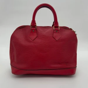 Louis Vuitton Epi Alma - Louis Vuitton Epi Alma Hand Bag  Skick: C, väldigt fint vintage skick. Se alltid bilder för egen uppfattning.  Serienummer: AR0996  Sku: V014  Mått: B31cm x H24cm x D17cm
