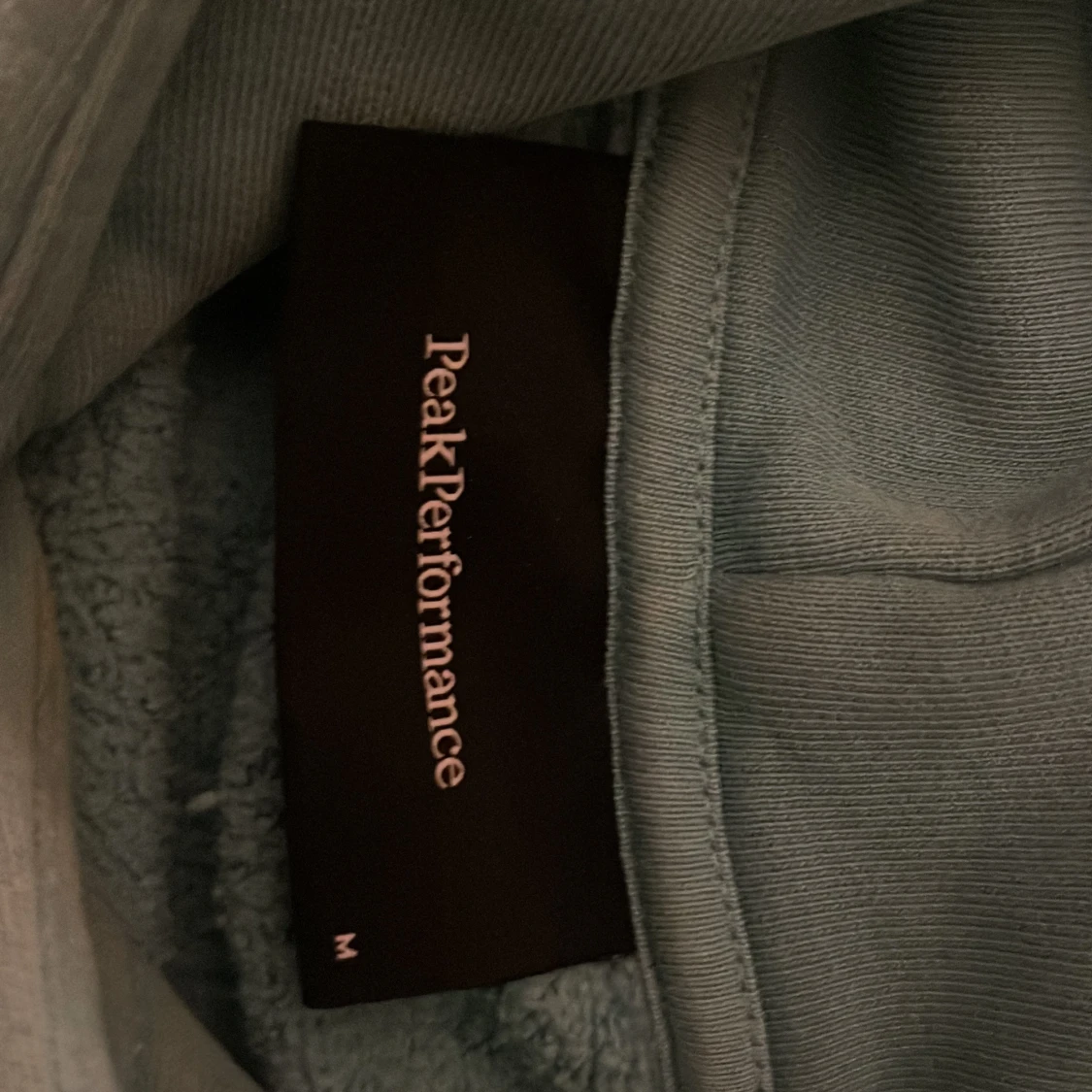 Grön hoodie från Peak Performance - 90