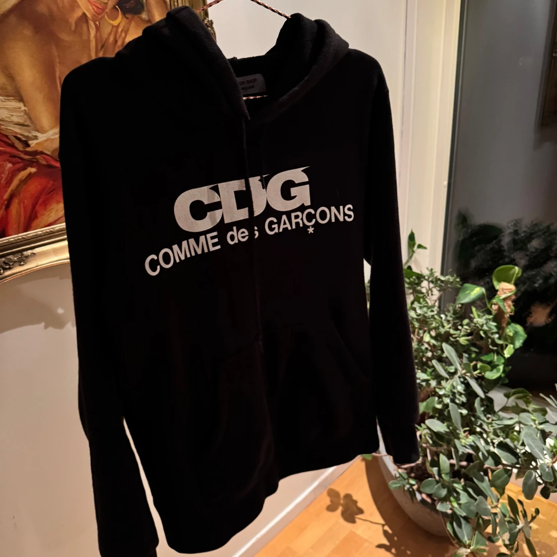 Svart hoodie från Comme des Garçons