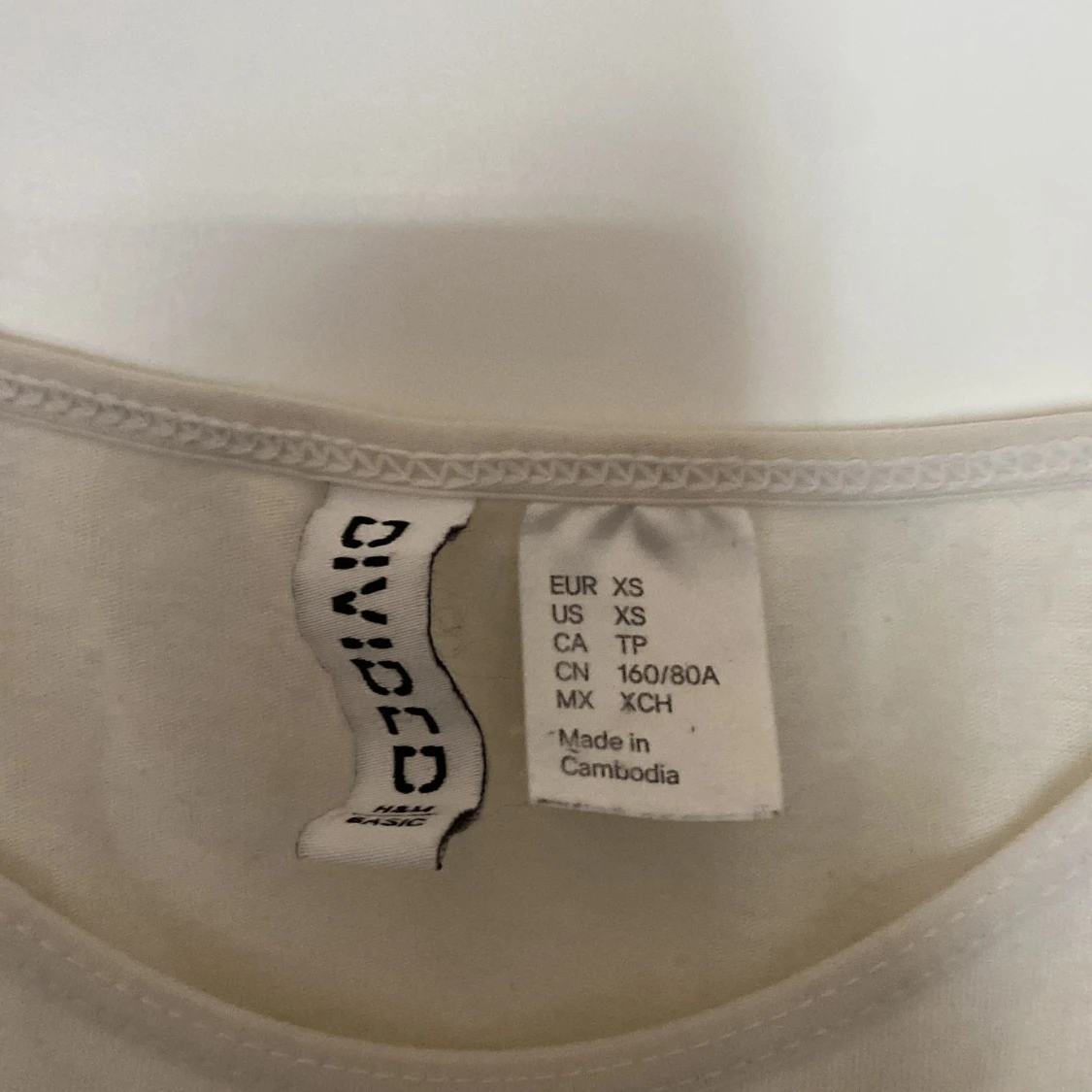 Vit linnetopp från Divided - 91