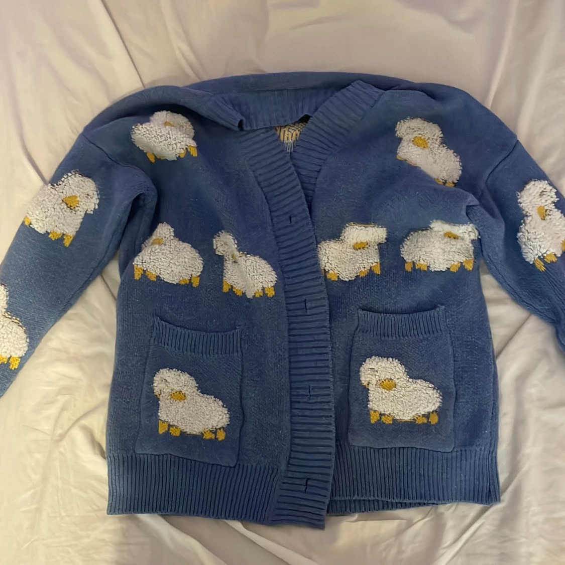 Blå kofta med får