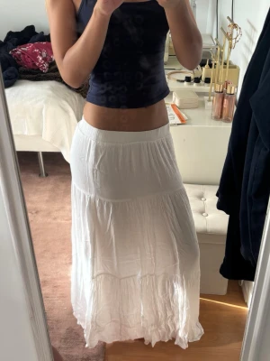 Low Rise White Maxi Skirt -  Beautiful low-rise white maxi skirt with a relaxed, effortless fit. Perfect for a minimalist Scandinavian wardrobe and the clean Stockholm style aesthetic. Lightweight, flowy, and ideal for summer, vacations, or everyday wear.  * Low-rise fit * White maxi skirt * Flowy and timeless style * Easy to dress up or down * Great condition