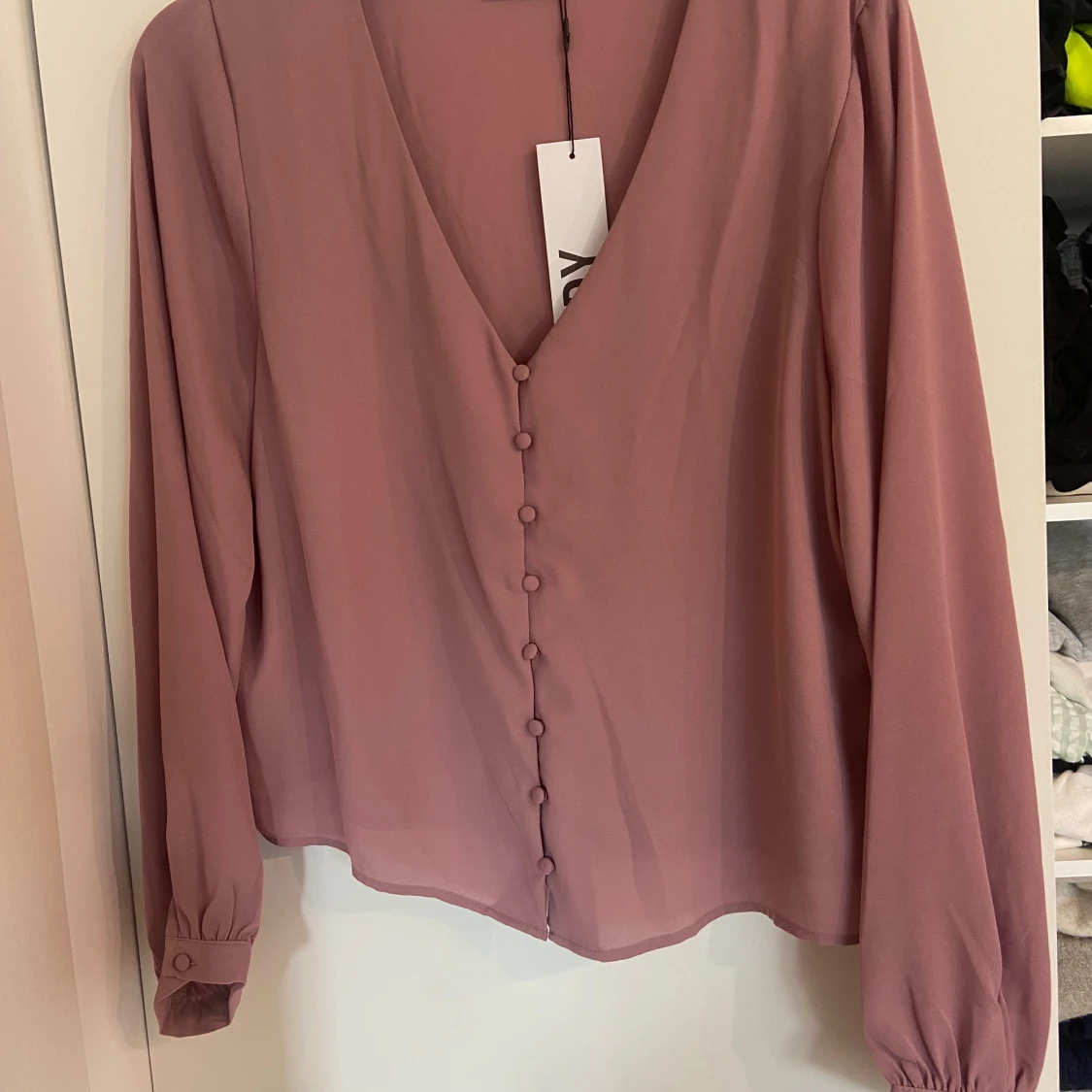 Rosa blus storlek 42