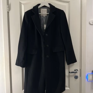 Kappa  - Oanvänd svart kappa stolen 36