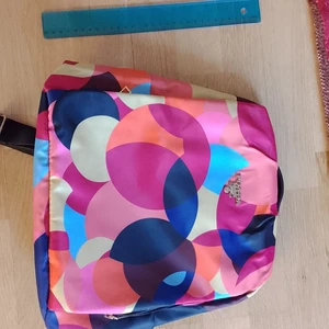 Backpack - Colourful backpack bought last year. Because I have too many bags, I ended up not using it at all. It is waterproof and designed to be anti-theft since all of the zippers are either on the back side or hidden on both sides (third picture shows side zipper). 