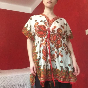  - A dress with fabulous patterns and an andjustable waist that makes it fit all sizes!