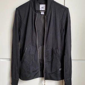 Adidas bomber jacket - Adidas originals mesh bomber jacket. Oversized cut, size 38.  Excellent condition, never worn.