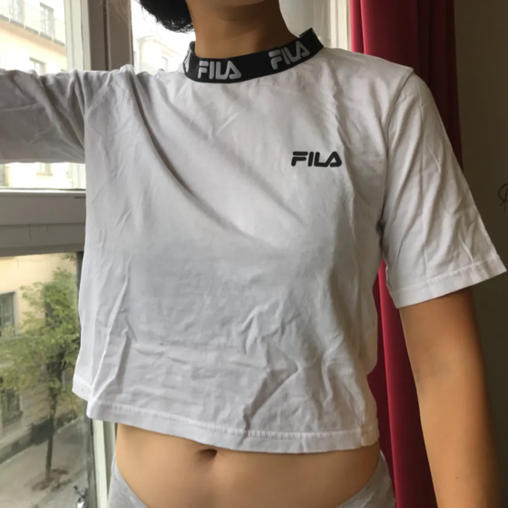 Fila t-shirt from Urban Outfitters. It says XS but I’m a Medium wear and the XS fits me perfectly - I’m not wearing it baggy but fit.. T-shirts.