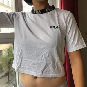 Fila t-shirt from Urban Outfitters. It says XS but I’m a Medium wear and the XS fits me perfectly - I’m not wearing it baggy but fit.