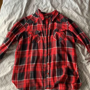  - It’s suits the small and the Medium size it’s a classic red  shirt 