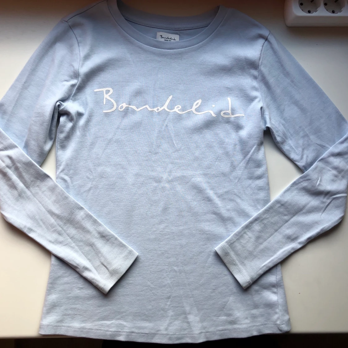 Ljusblå tröja från bondelid