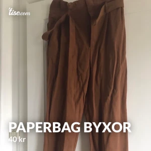 Byxor - Bruna paperbagbyxor från H&M, knappt använda