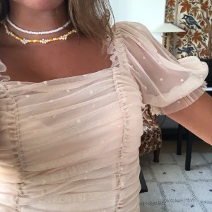 Puffärmad top - Superfin top ifrån hm som är slutsåld i denna storlek, ljusrosa och sitter jättefint! Använd 1 gång, frakt tillkommer!