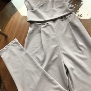 One piece  - Bought in a boutique in London, wore a few times, full length bottom