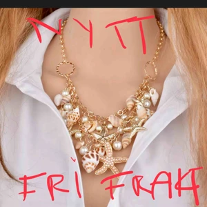  - NYTT TJUSIGT ARMAND/20CM  MED SNÄCKOR. Material: metallisk med låssas snäckor. BJUDER PÅ PORTOT OCH EN GLITTRIG ETUIET SE BILDERNA NYTT PLOMBERAD . 