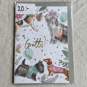 Gratulationskort  - Ett charmigt gratulationskort med färgglada illustrationer av hundar, ballonger och blommor. Medföljer kuvert samt den är kvar i sin ursprungliga förpackning. Insidan består av helt vita blad så plats för mycket text 