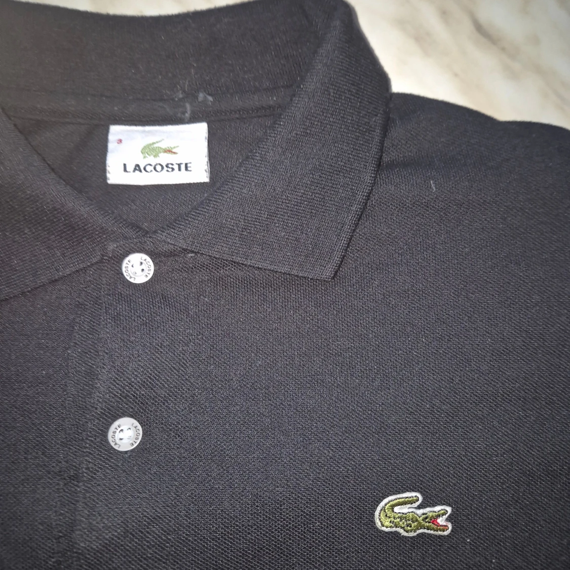 Svart pikétröja Lacoste - 1