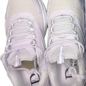 Dior sneakers - These are white Dior sneakers in excellent condition, featuring a sleek design with mesh and leather accents.  ⭐️ Condition: 10/10 🎨 Color: White 📦 Fast and careful shipping