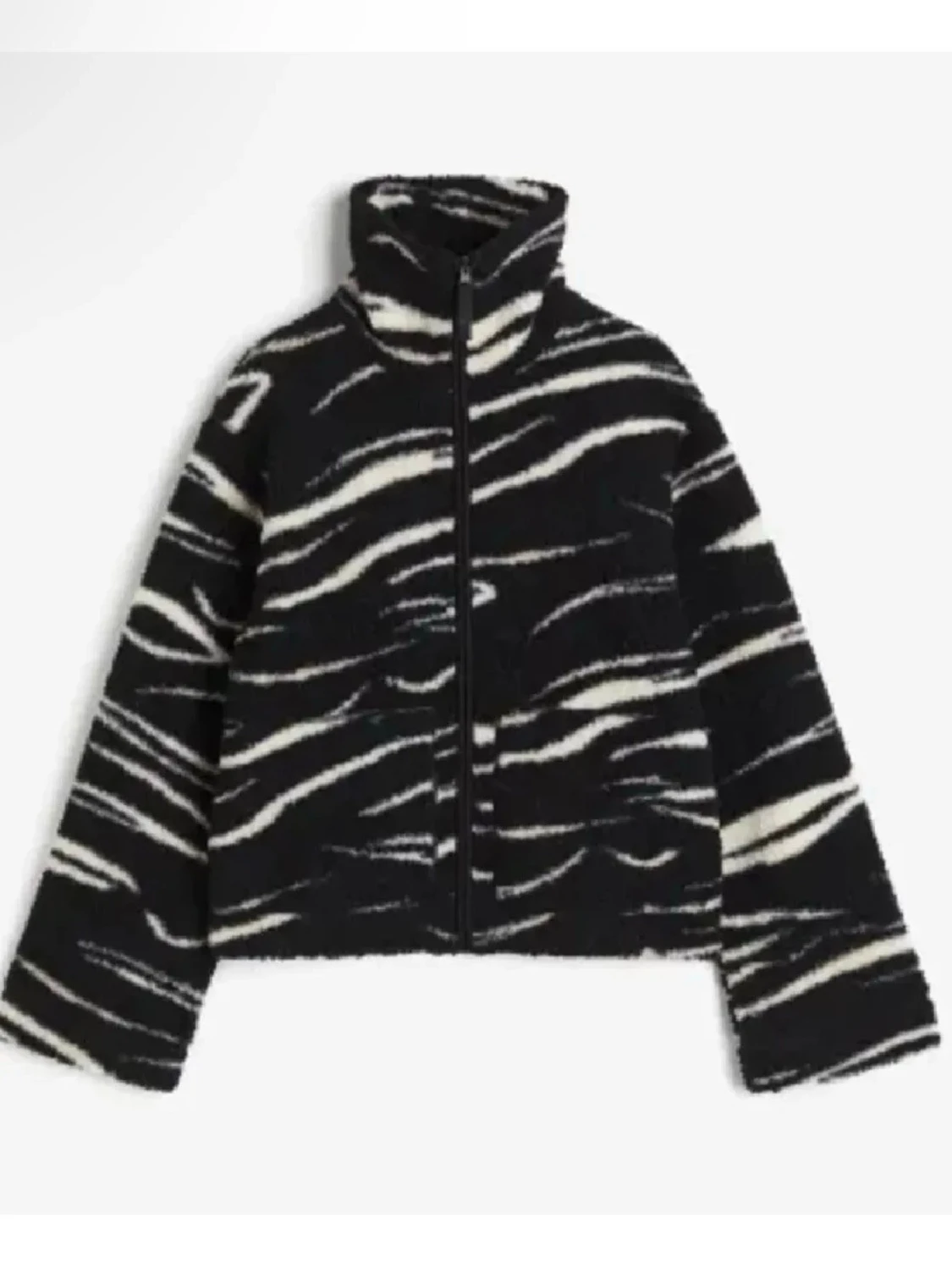 Svartvit teddyjacka med zebramönster