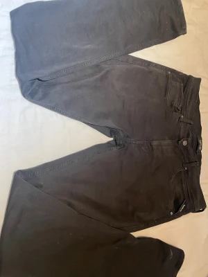 Svarta Replay jeans - Svarta replay jeans storlek 32/34