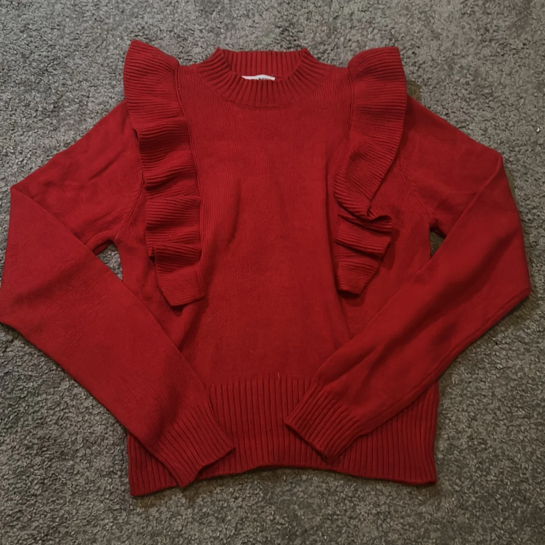 Stickad tröja röd