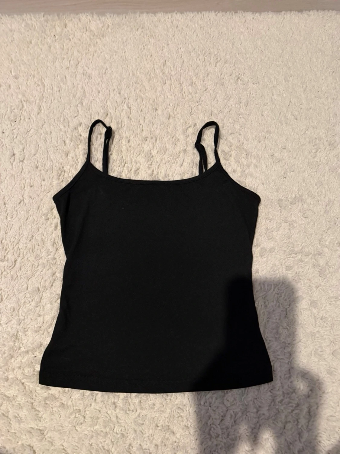 Svart enkel linnetopp