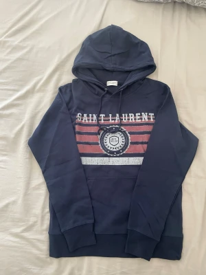 Saint Laurent hoodie blå - Priset kan diskuteras, fraktar samma dag. Inga skador eller defekter.